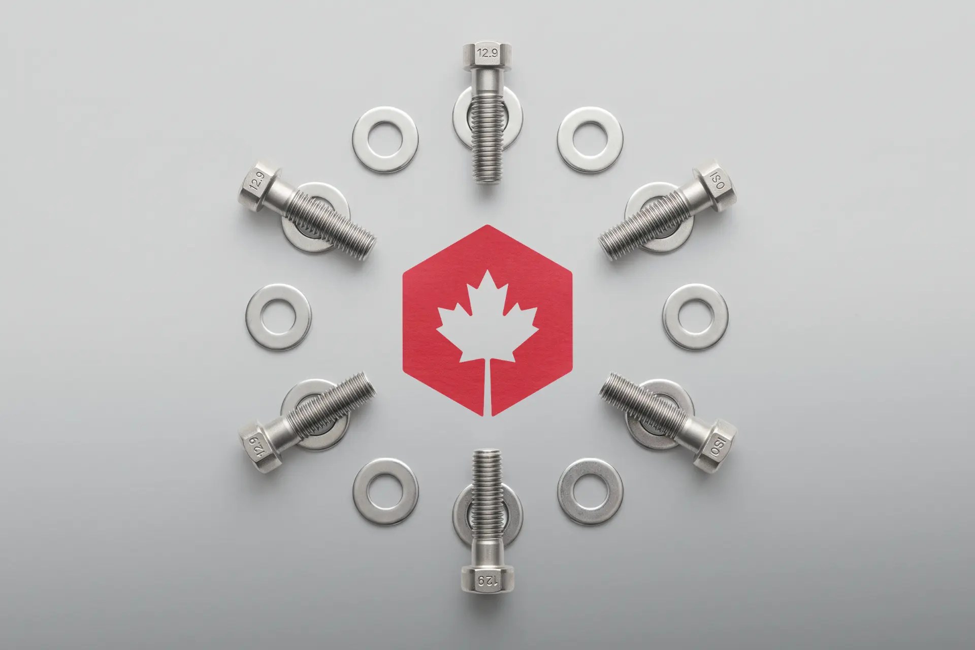 Canada Bolt industrial supply website shown on a laptop and phone in a warehouse