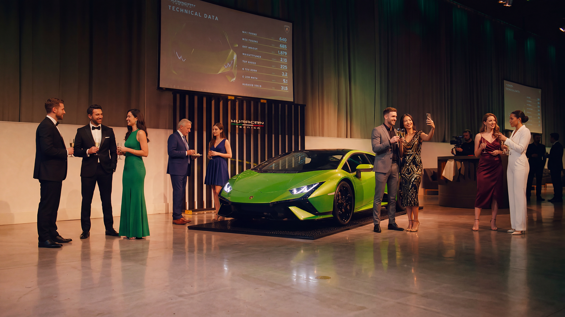 Black Lamborghini at an evening event with dramatic lighting